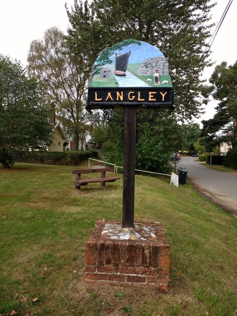 Village sign entering Langley